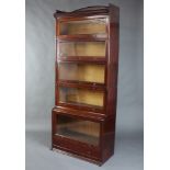 A 1920's Lebus mahogany 6 tier Globe Wernicke style bookcase with three-quarter gallery, moulded and