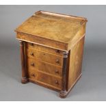 A Victorian walnut slide top Davenport with fitted interior, the pedestal with 4 drawers flanked