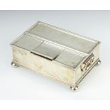 A rectangular silver treasury ink stand with 1 long compartment and 3 short lidded compartments,