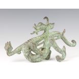 A Chinese bronze figure of a dragon 12cm h x 22cm w x 5cm d