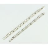 A silver flat link bracelet and 1 other bracelet, 50 grams