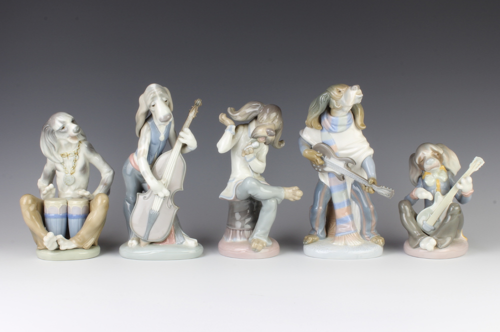 A Lladro 5 piece band of dog musicians 15cm, 20cm, 19cm, 22cm and 22cm