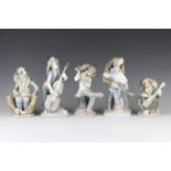 A Lladro 5 piece band of dog musicians 15cm, 20cm, 19cm, 22cm and 22cm