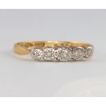 An 18ct yellow gold 5 stone diamond illusion set ring size N