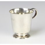 A silver pedestal mug with C scroll handle, London 1945, 229 grams