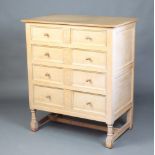 A Heals White Spot 17th Century style limed oak chest of 2 short and 3 long drawers, raised on