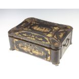 A Regency black lacquered chinoiserie style box with hinged lid, the interior fitted a tray with