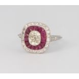 A platinum, diamond and ruby Art Deco style ring with centre old cut diamond approx. 1ct in total
