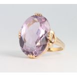 A 9ct yellow gold oval amethyst dress ring size O