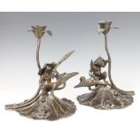 A pair of 19th Century Japanese bronze candlesticks in the form of lily pads with seated toads and