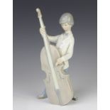 A Lladro figure of a young man playing a double base 25cm