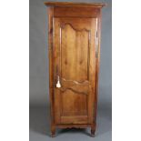 An 18th Century French provincial cherry cabinet with cornice and shelved interior enclosed by a