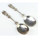 A pair of Victorian silver serving spoons with figural handles London 1897 and 1898, 135 grams