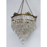 A circular gilt metal and glass 6 tier light fitting hung lozenges 39cm h x 25cm diam. 8 lozenge