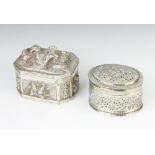 An Indian repousse silver octagonal rectangular trinket box decorated with figures 9cm and an oval