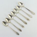 Seven Continental silver teaspoons with bright cut decoration 76 grams