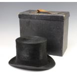 A gentleman's black silk top hat by Berkeleys 125 Victoria Street, complete with carrying case, size