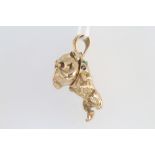 A 9ct yellow gold charm in the form of a bulldog set with gem stones 12.1 grams
