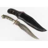 An Indian Kris style dagger with 22cm blade, horn grip and leather scabbard