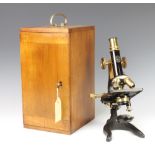 A C Baker Japanned and gilt metal single pillar microscope no.6492 complete with carrying case