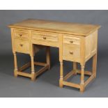 A Heals White Spot oak dressing table with linen fold decoration, fitted 1 long and 4 short drawers,