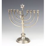 A Continental silver menorah candle holder 507 grams, 29 cm