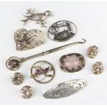 A silver brooch and minor silver jewellery 59 grams