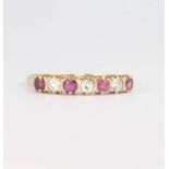 A 9ct yellow gold ruby and diamond ring 1.4 grams, size M