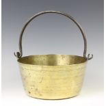 A circular brass preserving pan with polished steel swing handle 11cm h x 24cm diam.