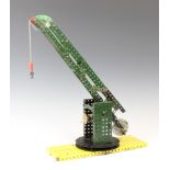 A red and green Meccano working model of a crane 34cm h x 11cm