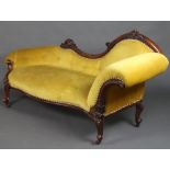 A Victorian carved walnut show frame settee upholstered in yellow buttoned material 94cm h x 192cm w