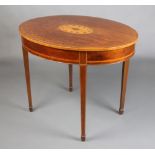 An Edwardian oval inlaid mahogany occasional table raised on square tapered supports, spade feet