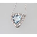 A white gold triangular cut aquamarine and diamond pendant, the centre stone approx. 2.7ct