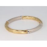 A 9ct 2 colour gold twist bangle 11.7 grams