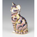 A Royal Crown Derby Imari pattern paperweight in the form of a seated cat with gold stopper 12cm