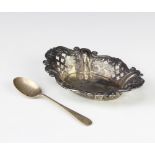 An oval repousse and pierced silver bon bon dish Sheffield 1919 and a silver coffee spoon 36 grams
