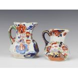 A pair of Victorian ironstone jugs decorated in the chinoiserie style 13cm and 17cm, the larger
