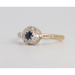 An 18ct yellow gold sapphire and diamond cluster ring 3.5 grams, size O 1/2