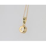 An 18ct yellow gold diamond set pendant and chain