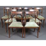 A set of 8 Regency style bar back dining chairs with rope mid rails and upholstered drop in seats,