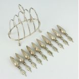A silver 5 bar toast rack and 10 sterling silver sweetcorn picks, 93 grams gross