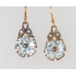 A pair of silver gilt, pale blue topaz and diamond floral earrings 25mm