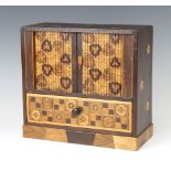 A Japanese inlaid marquetry cabinet, the upper section with tambour shutter revealing 2 long drawers