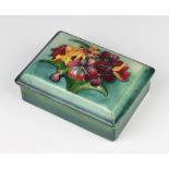 A Moorcroft rectangular box and cover decorated with flowers, with signature, impressed mark and