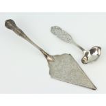 A Sterling silver serving spoon with pierced handle together with a plated cake slice 55 grams