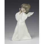 A Lladro figure of an angel 22cm