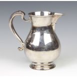 A silver Georgian design jug with S scroll handle London 1913, 18cm, maker Herbert Charles