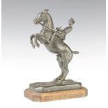 A French bronze figure of Cavalryman from the Cadre Noir raised on a wooden base 25cm x 16cm x 11cm,