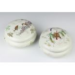A pair of early 20th Century Japanese porcelain cylindrical boxes and covers decorated with