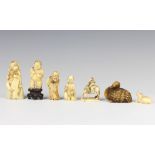 A Meiji period Japanese carved ivory okimono of a seated scholar 6.5cm, 3 other carved figures, a